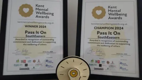 Southeastern Railway Certificates and a trophy for the Kent Mental Wellbeing Award, given to Southeastern Railways