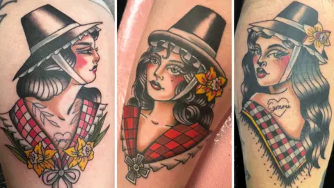 Jessica Tucker A composite of three photographs showing Welsh lady tattoos. From left to right: A tattoo of a pin up woman, she has wavy black hair and wears a Welsh chimney hat, a daffodil in her hair, and a red and white checked shawl. On her chest she has the word "Cymru" within a heart. A tattoo of a pin up woman, she has black curly hair and wears a Welsh chimney hat, a daffodil in her hair, and a red shawl. A tattoo of a pin up woman, she has long black wavy hair and wears a Welsh chimney hat, a daffodil in her hair, and a black and red checked shawl. On her back she has the word "Cymru" within a heart. 