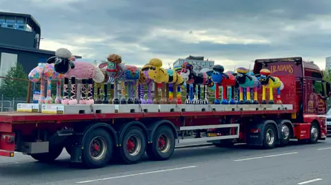 St Oswald's Hospice Shaun the sheep sculptures on the back of a lorry