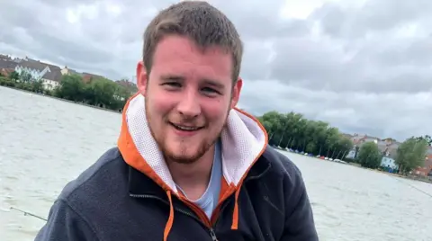 Family Tom Ellis smiling at the camera