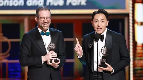 Will Aronson and Hue Park hold their Tony Awards on stage.