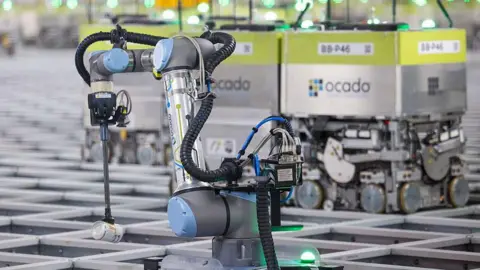 Bloomberg via Getty Images A robot in an Ocado delivery centre 