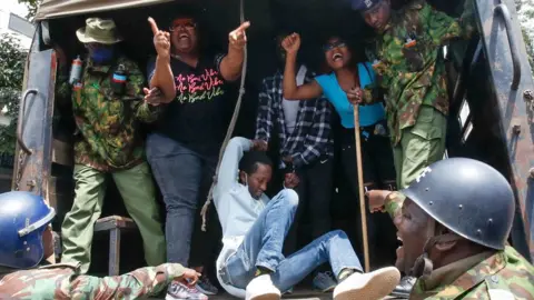 Reuters Protesters in a police vehicle in Nairobi, Kenya - 18 June 2024