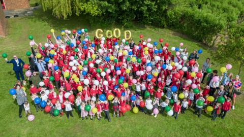 Overhead view of pupils and staff at Ormesby Primary School 