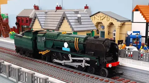 Lego UK Railway Green locomotive made out of Lego on brick tracks