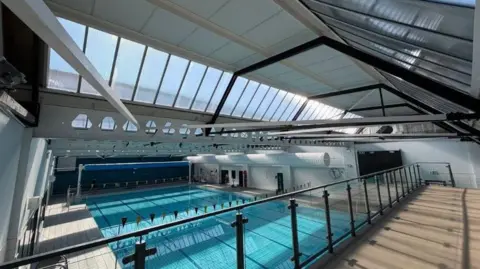 A photo of an indoor swimming pool. 