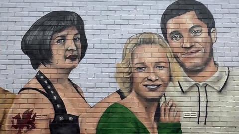 Nessa, Stacey and Gavin painted on a garden wall