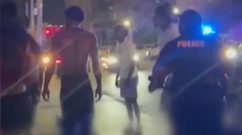 People standing on street after shooting