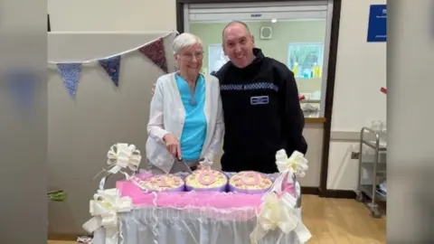 Policing Peterborough Woman cuts birthday cake