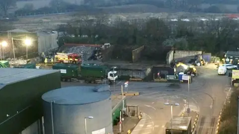 Stephen Huntley/BBC An aerial of above the waste recycling centre. One fire engine is at the scene. 