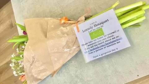 BBC Flowers with an attached note