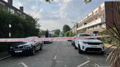 BBC/Anna O'Neill A police cordon on a street