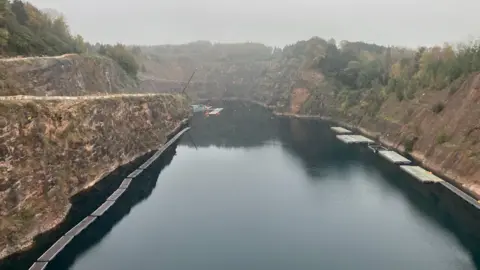 Quarry filled with water.