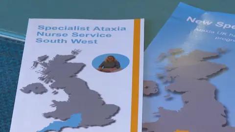BBC The leaflet shows a map of Great Britain and the area the nurse covers is marked in blue. Her picture is in the top right corner of the leaflet. It says Specialist Ataxia Nurse Service South West on it.