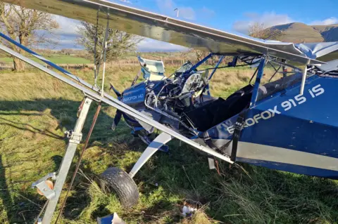 Mid Wales fire service Plane wreckage in a field