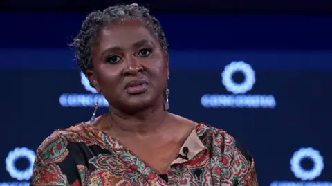 Getty Images The former first lady of Namibia is seen here in a dark floral print dress at an event in New York City.