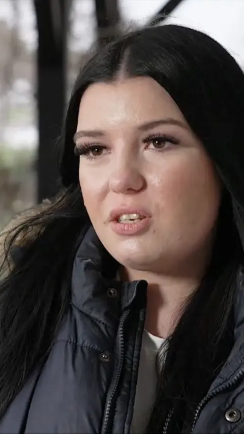 Close up of young woman with dark hair
