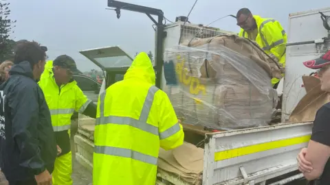 The authorities delivered sandbags to areas on the hurricane track in Queensland Australia