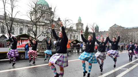 Pacemaker Press The picture shows a number of girls in kilts Highland dancing past Belfast City Hall