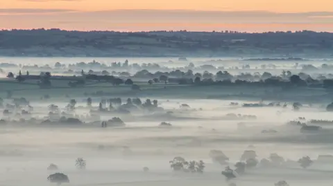 BBC A very low cloud causing mist over the Somerset Levels