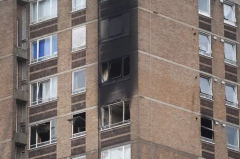 PA Media Flats wrecked by the fire blackened by smoke and flame 