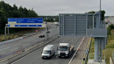 Google Street View image of the M621, showing signs to Middleton, Castleford Pontefract, London, Wakefield and Hull.