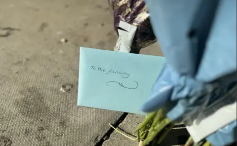 Emma Baugh/BBC An envelope with the words 'To the family' written on it