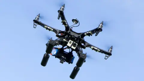 Getty Images Sebuah drone terbang di langit