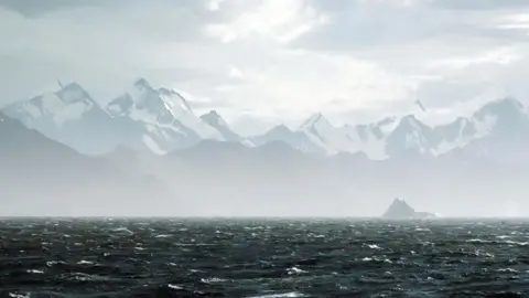 Michael Begg Mist covering an iceberg in Antarctica  