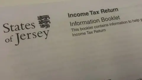 BBC The top of an income tax return letter with the States of Jersey emblem on the left and tax info on the right.