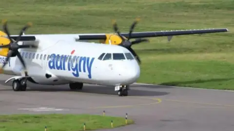 BBC An Aurigny aeroplane on the runway