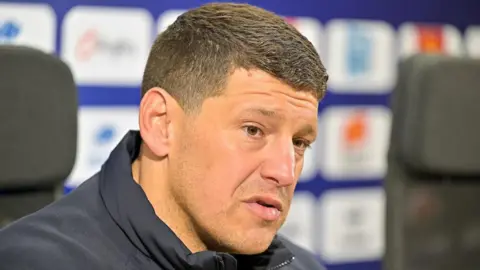 Wigan Warriors head coach Matt Peet addresses the media at a press conference