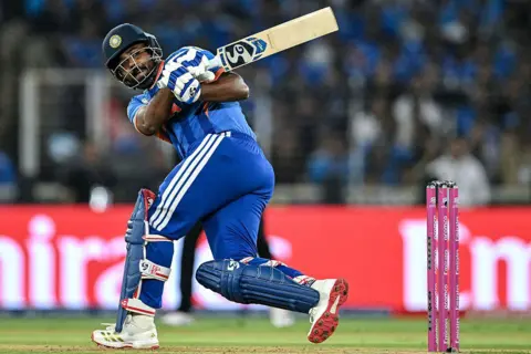 AFP via Getty Images India's Sanju Samson plays a shot during the 2026 ICC Men's T20 Cricket World Cup final match between India and New Zealand at the Narendra Modi Stadium in Ahmedabad on March 8, 2026. (Photo by Punit PARANJPE / AFP via Getty Images)
