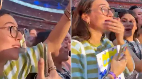 Billy's Bus A girl in a yellow and white striped t-shirt at a concert. She is wearing glasses and holding her arm in the air. She holds her hand over her mouth in the second picture. 