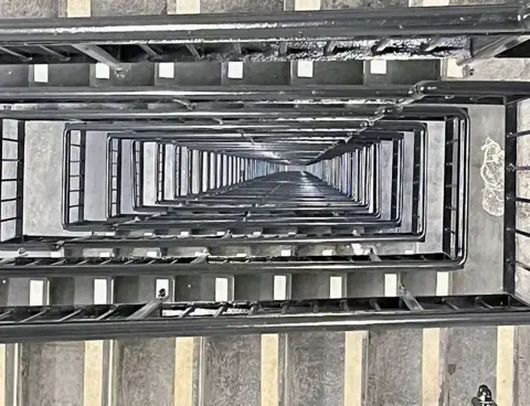 Looking down   the stairwell from the 75th level  of the Landmark Pinnacle