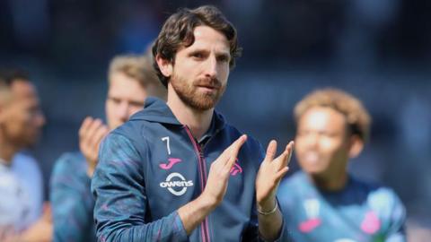 Joe Allen applauds Swansea City's fans after defeat to Millwall on the final day of 2023-24
