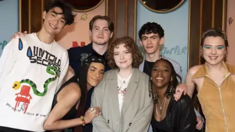 Writer Alice Oseman (centre) with the cast of Heartstopper