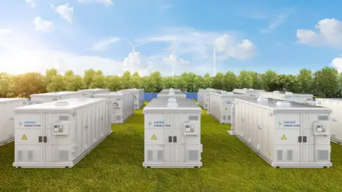 An artists impression of a battery energy storage scheme with large units sitting on a grass field with wind turbines and trees in the distance