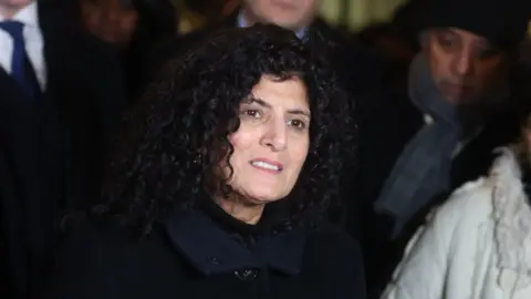 PA Image of Farah Naz, Zara Aleena's aunt, reads a statement outside the Old Bailey in December 2022