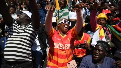 Zimbabwe fans dance