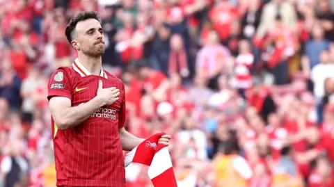 Diogo Jota of Liverpool acknowledges the crowd after a Premier League match