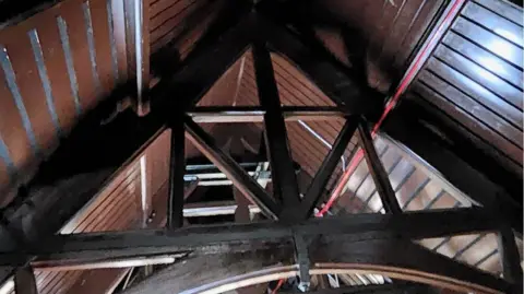 Trowbridge Town Hall Trust Inside a vaulted roof - dark wood beams and trusses