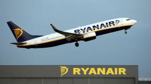 A Ryanair plane taking off from an airport 