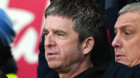 PA Noel Gallagher looking serious at the Bournemouth game