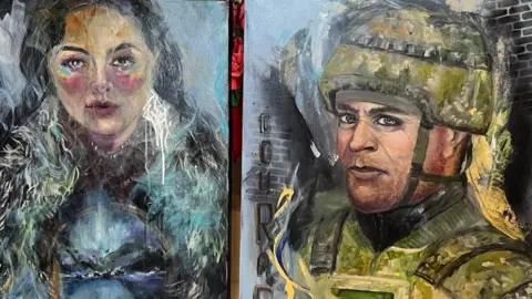 Two paintings from Viktoriya Richardson - one of a Mother Earth figure holding a mountain landscape with wild animals crossing a river, another painting of a Ukrainian combat soldier