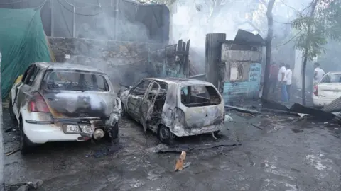 Torched vehicles successful  the aftermath of the violence