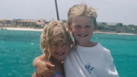 Charlotte Bresnahan Charlotte and Ryan as children. The sea can be seen behind them.