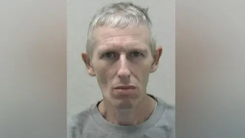 Northumbria Police Mugshot of Anthony Whitesmith. He is pale and has short white hair.