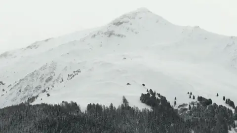 The AFP / Getty picture shows a mountain of snow in the French Alps