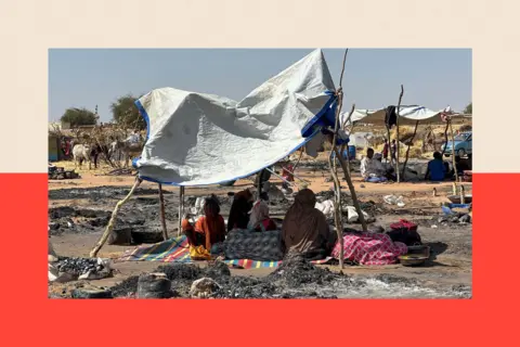 AFP via Getty Images Displaced Sudanese people sit in the shade amid the remains of a fire that broke out in the camp
